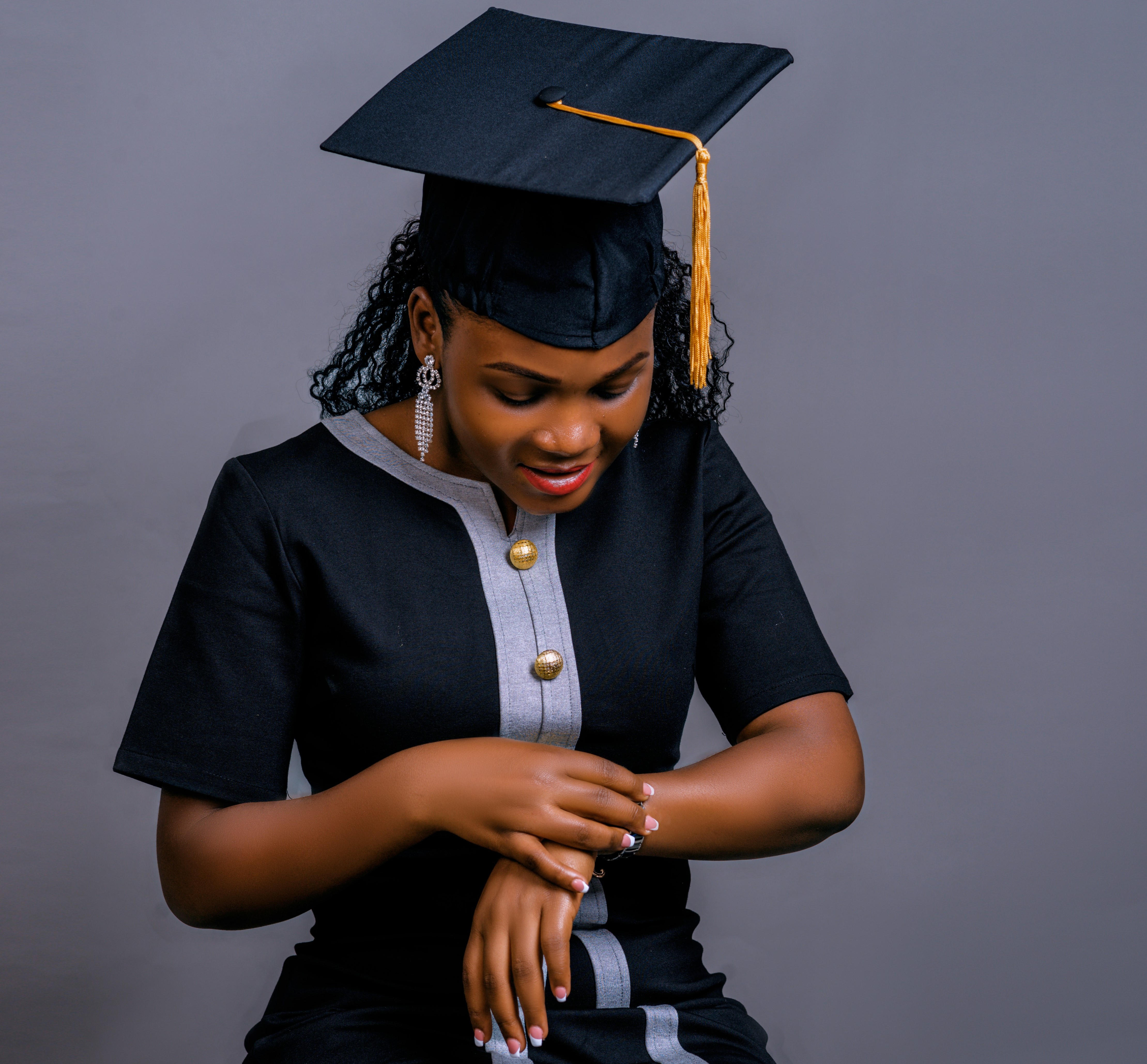 Photo by <a href="https://unsplash.com/@256p?utm_content=creditCopyText&utm_medium=referral&utm_source=unsplash">Patrick Otim</a> on <a href="https://unsplash.com/photos/a-woman-sitting-on-a-stool-wearing-a-graduation-cap-and-gown-0sJqQa3Q0Wo?utm_content=creditCopyText&utm_medium=referral&utm_source=unsplash">Unsplash</a>   